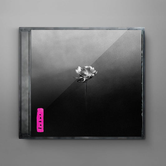 CD case with a flower illustration on a gray background