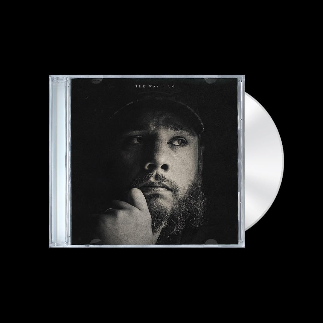 Vinyl record and cover with a black and white photo of a person on a black background
