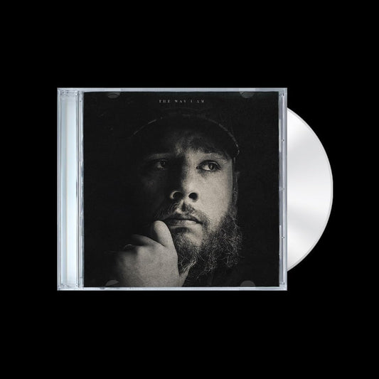 Vinyl record and cover with a black and white photo of a person on a black background