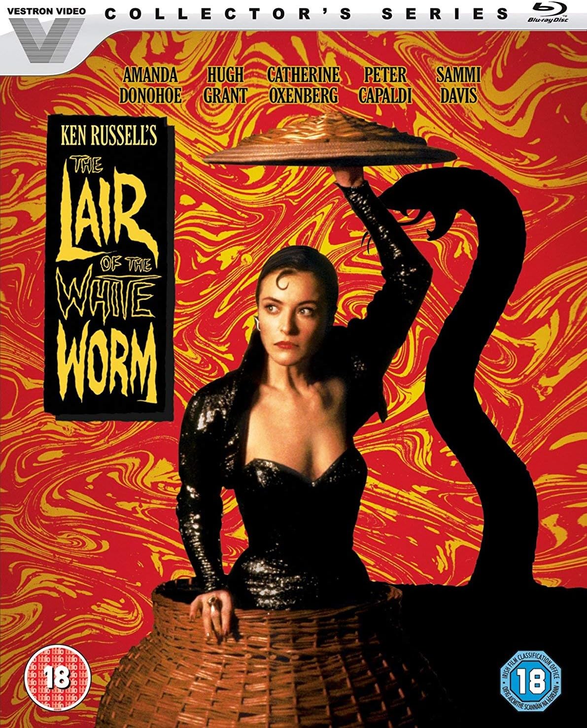 The Lair of the White Worm collector's series Blu-ray cover featuring Ken Russell's film artwork, with a woman in a black dress holding a tray over her head and a large black snake silhouette against a red and yellow swirling background. Vestron Video branding and age rating logos are visible.