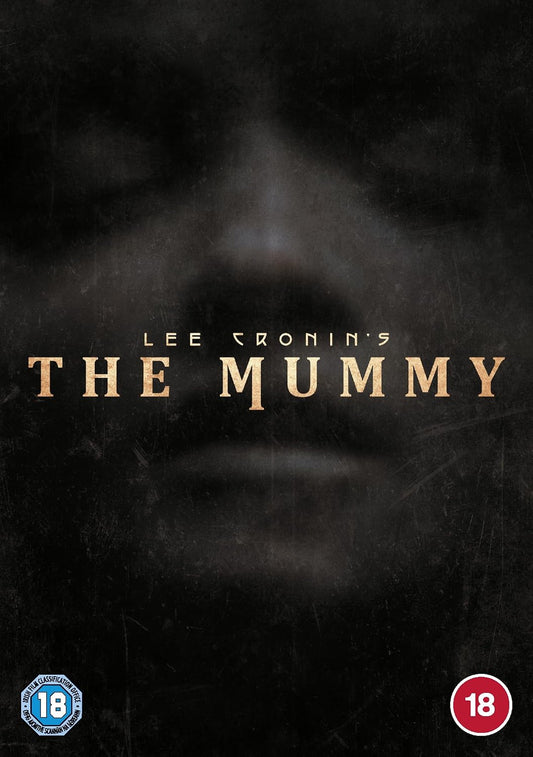 The movie cover for Lee Cronin's 'The Mummy' featuring a dark, textured background with a faint, shadowed face and the title in gold lettering. An 18 rating logo is visible in the bottom left corner, and an 18 rating circle is in the bottom right.