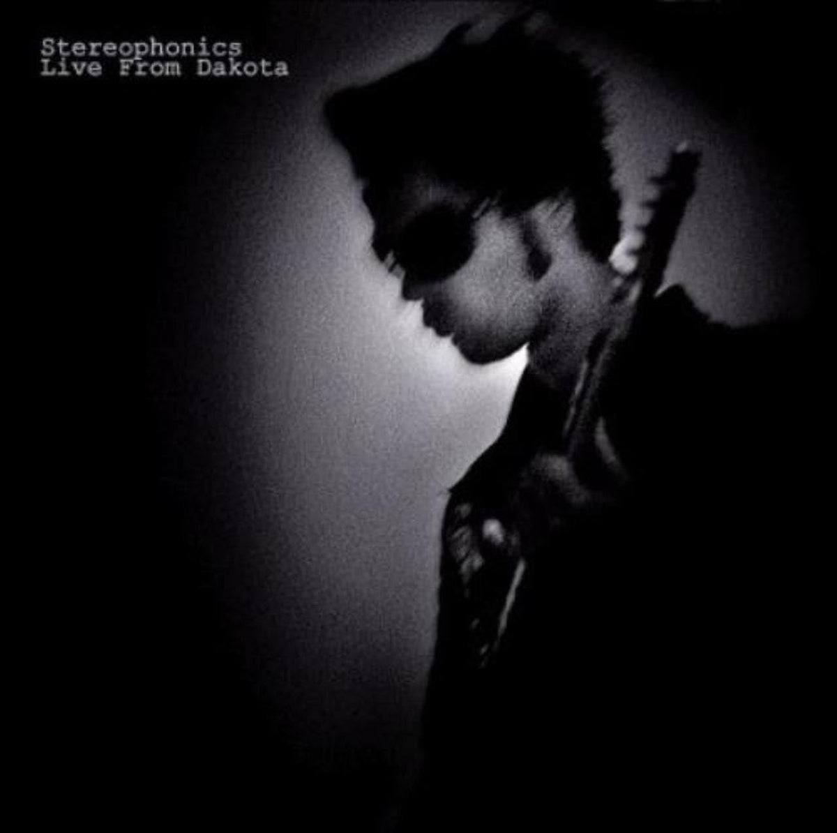 Album cover with a silhouette of a person holding a guitar against a dark background, featuring the text 'Stereophonics Live From Dakota'.