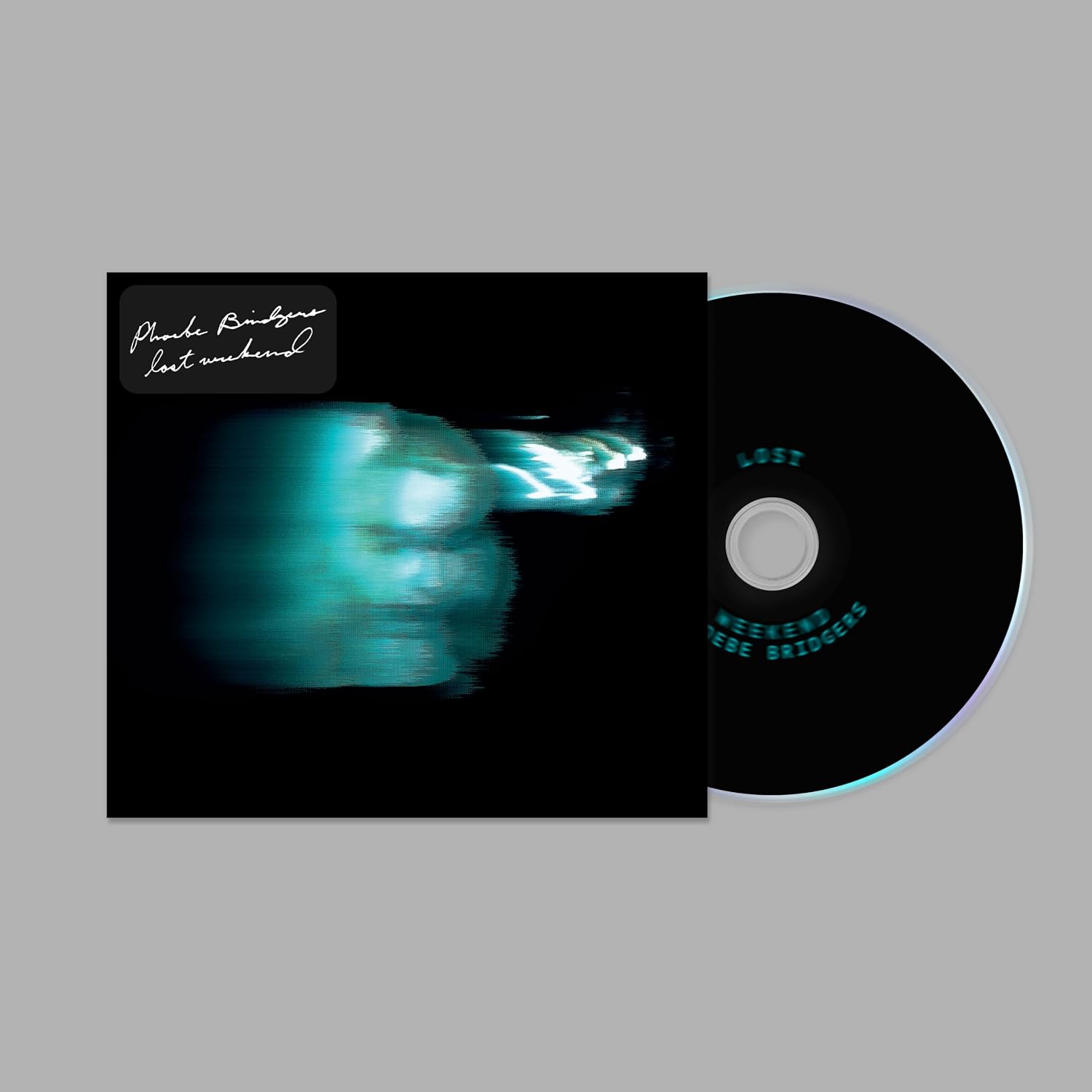 Vinyl record with a black cover and a CD on a gray background
