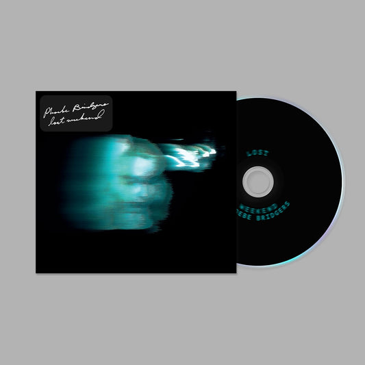 Vinyl record with a black cover and a CD on a gray background