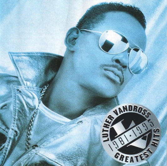 Album cover featuring a person wearing sunglasses with a blue gradient background and 'Luther Vandross Greatest Hits' logo.