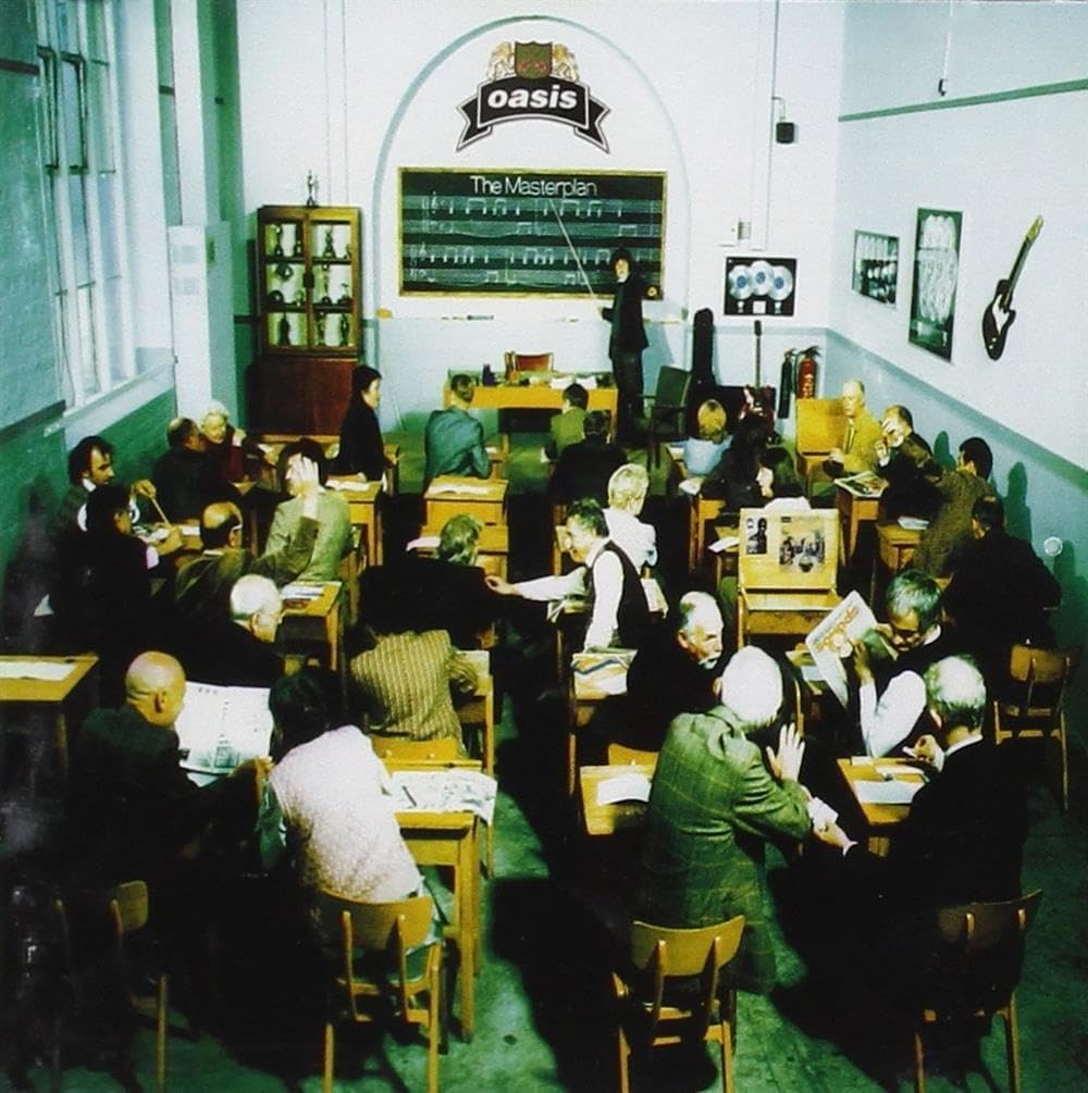Classroom scene with students and teacher, Oasis album cover in the background