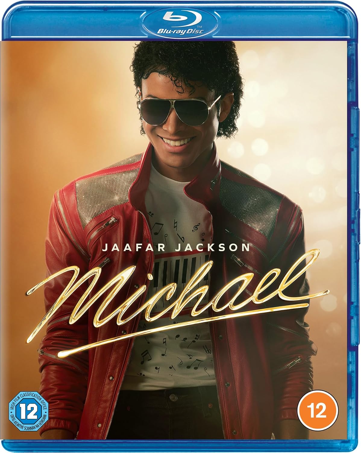 Blu-ray cover of 'Michael' featuring a person in a red jacket with sunglasses, on a warm-toned background.