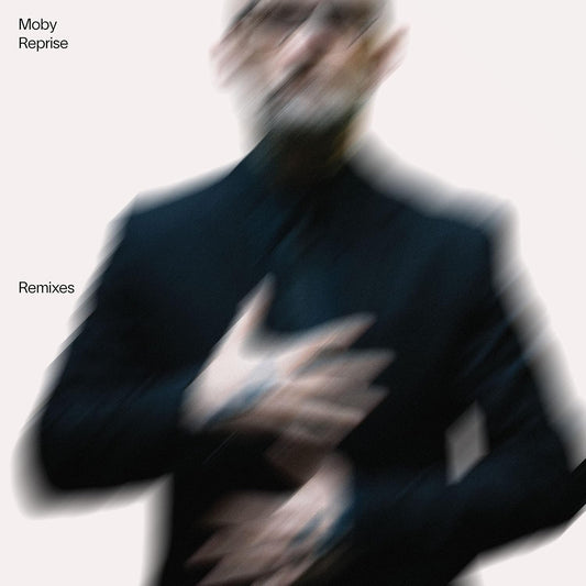 Album cover with a blurred figure and text 'Moby Reprise Remixes' on a light background