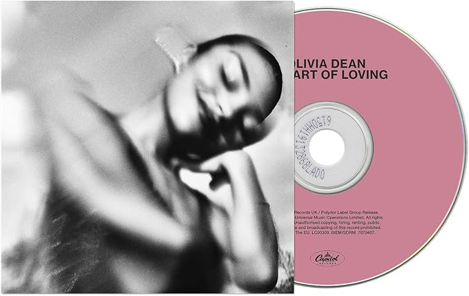 Album cover with a pink disc labeled 'Olivia Dean Heart of Loving' and a black and white photo on the left.