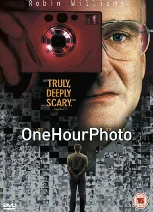 Movie poster for 'One Hour Photo' featuring a person with a camera and text.