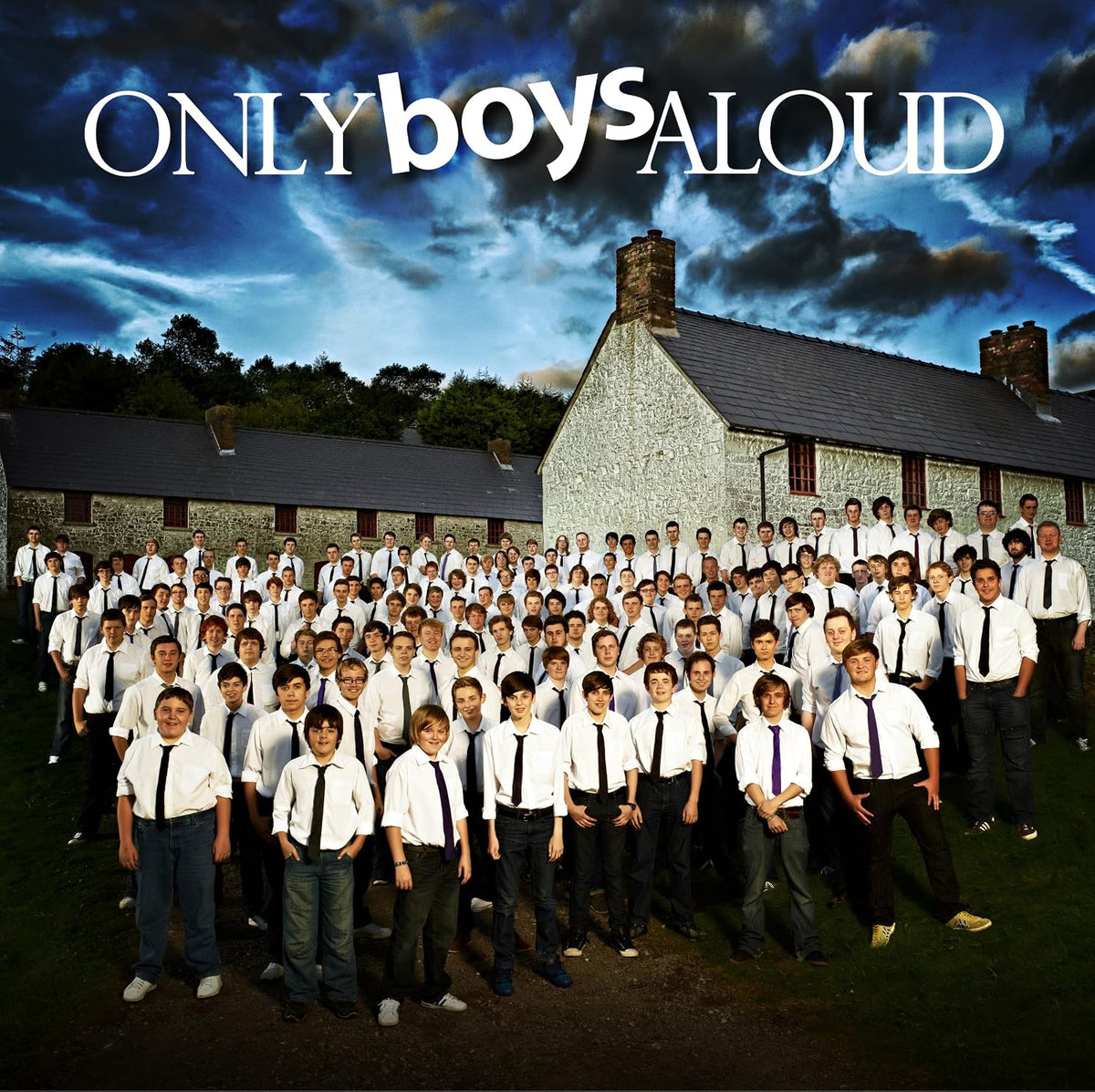 Album cover for 'Only Boys Aloud' with a group of boys in formal attire against a blue sky.