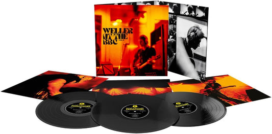 Vinyl record set with cover and three records on a white background