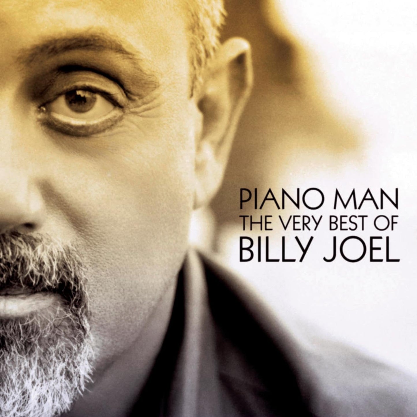 Album cover for 'Piano Man: The Very Best of Billy Joel' with a close-up of a man's face.
