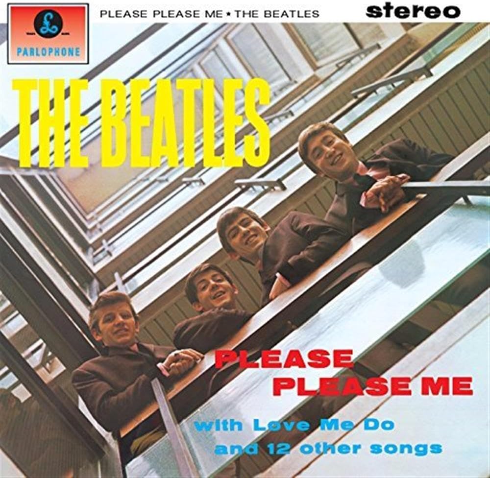 The Beatles 'Please Please Me' vinyl single cover artwork, showing the four band members leaning on an escalator. Large yellow 'THE BEATLES' text appears at the top, with red and blue song titles at the bottom and a Parlophone logo in the upper left.