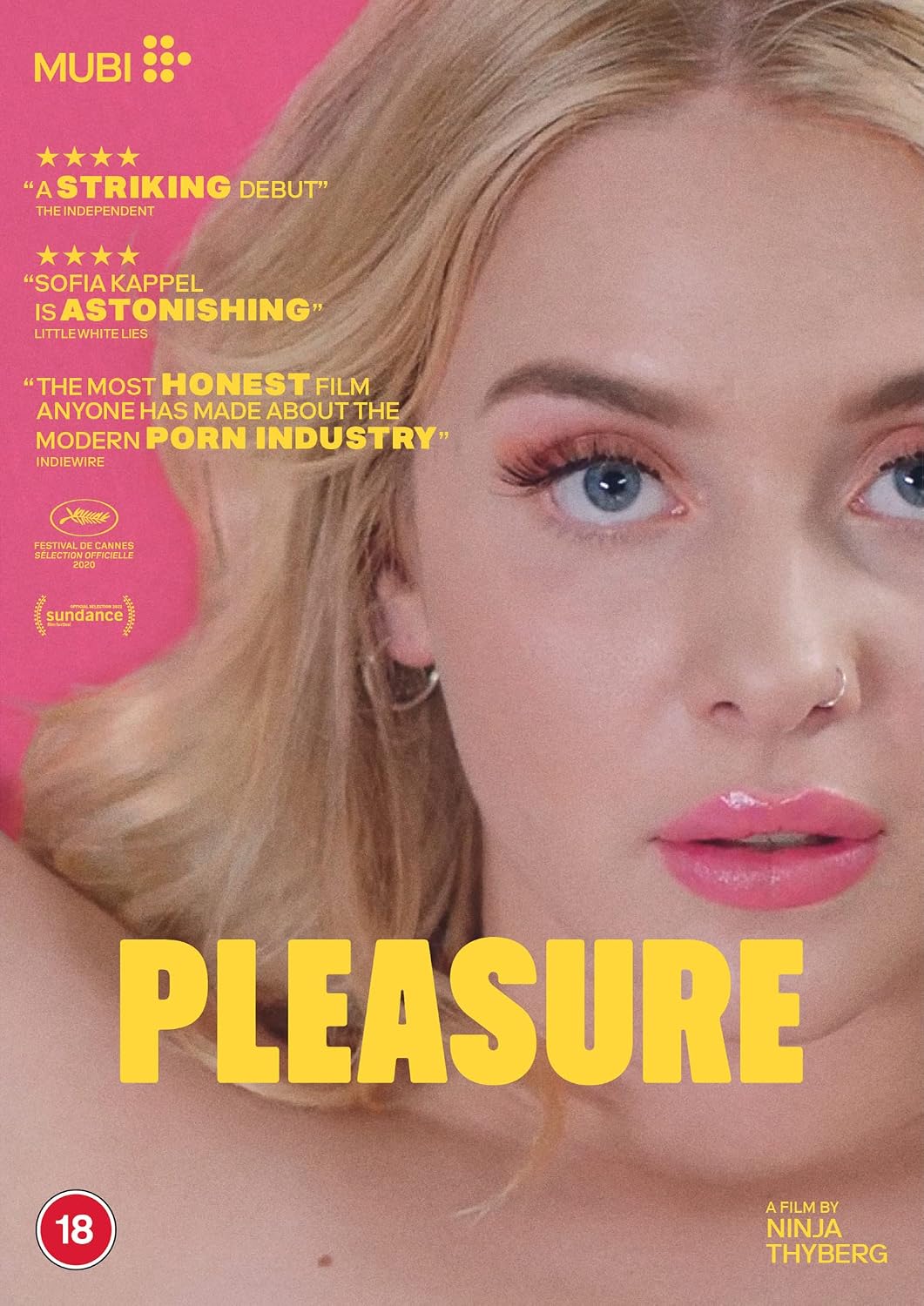 Movie poster for the film 'Pleasure' starring Sofia Kappel, featuring a close-up portrait of a blonde woman against a bright pink background with yellow title text and review quotes.