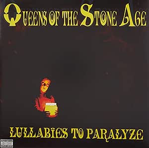 The product image shows the cover of the Queens Of The Stone Age vinyl album 'Lullabies to Paralyze'. It features a dark background with the band's logo in yellow and a person holding a beer in the foreground.