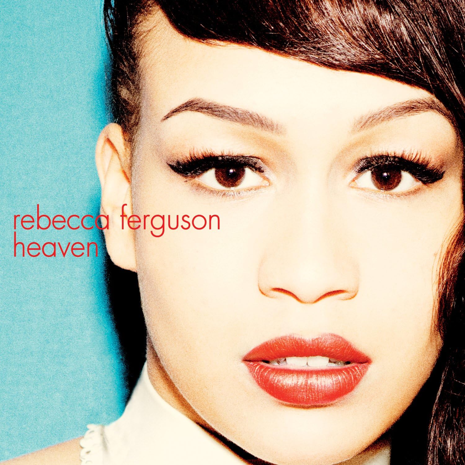 Album cover with a close-up of a person's face and the text 'rebecca ferguson heaven' on a blue background.