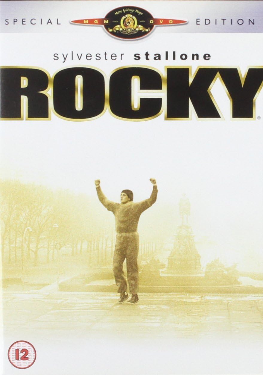Special Edition DVD cover for the movie Rocky, featuring Sylvester Stallone jumping in the rain with arms raised, under a large 'ROCKY' title. The cover has a warm yellowish tint and includes an MGM logo at the top.