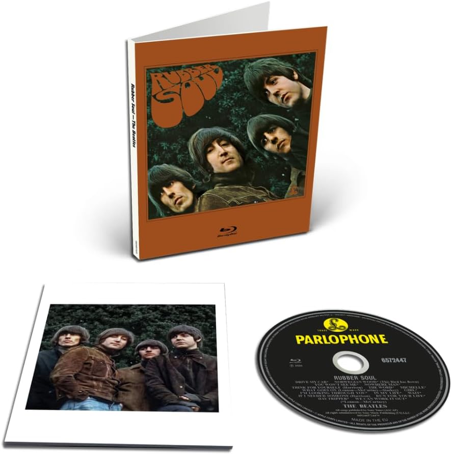 The Beatles 'Parlophone' 2CD Deluxe Edition Blu-ray package, showing the orange slipcase with the band's album art, the inner photo sleeve, and the black Parlophone CD.
