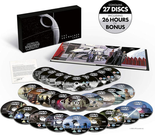Star Wars: The Empire Strikes Back 27-disc special edition home video set, including a black illustrated box, a printed booklet, and many CD-R discs arranged on a white background. A circular badge in the top right says it contains 27 discs including 26 hours of bonus film.