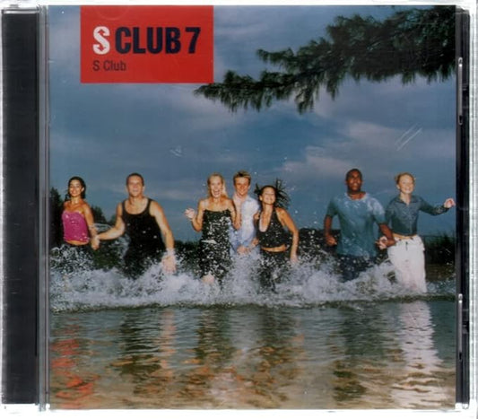 CD cover of S Club 7 featuring the band members running alongside a body of water with a blue sky in the background.