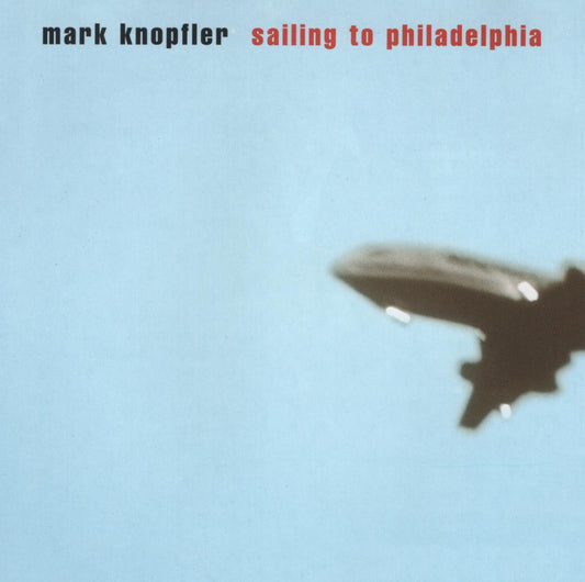 Album cover with airplane silhouette against a blue sky and 'mark knopfler sailing to philadelphia' text.