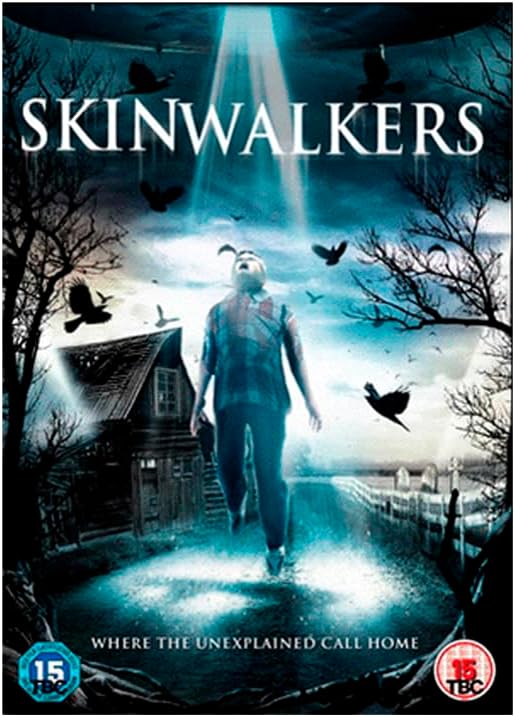 DVD cover for the horror film 'Skinwalkers' featuring a glowing figure walking toward the viewer in a dark, eerie village scene with crows, bare trees, and a house. The title 'SKINWALKERS' appears in large white letters at the top, with age rating logos in the bottom corners.