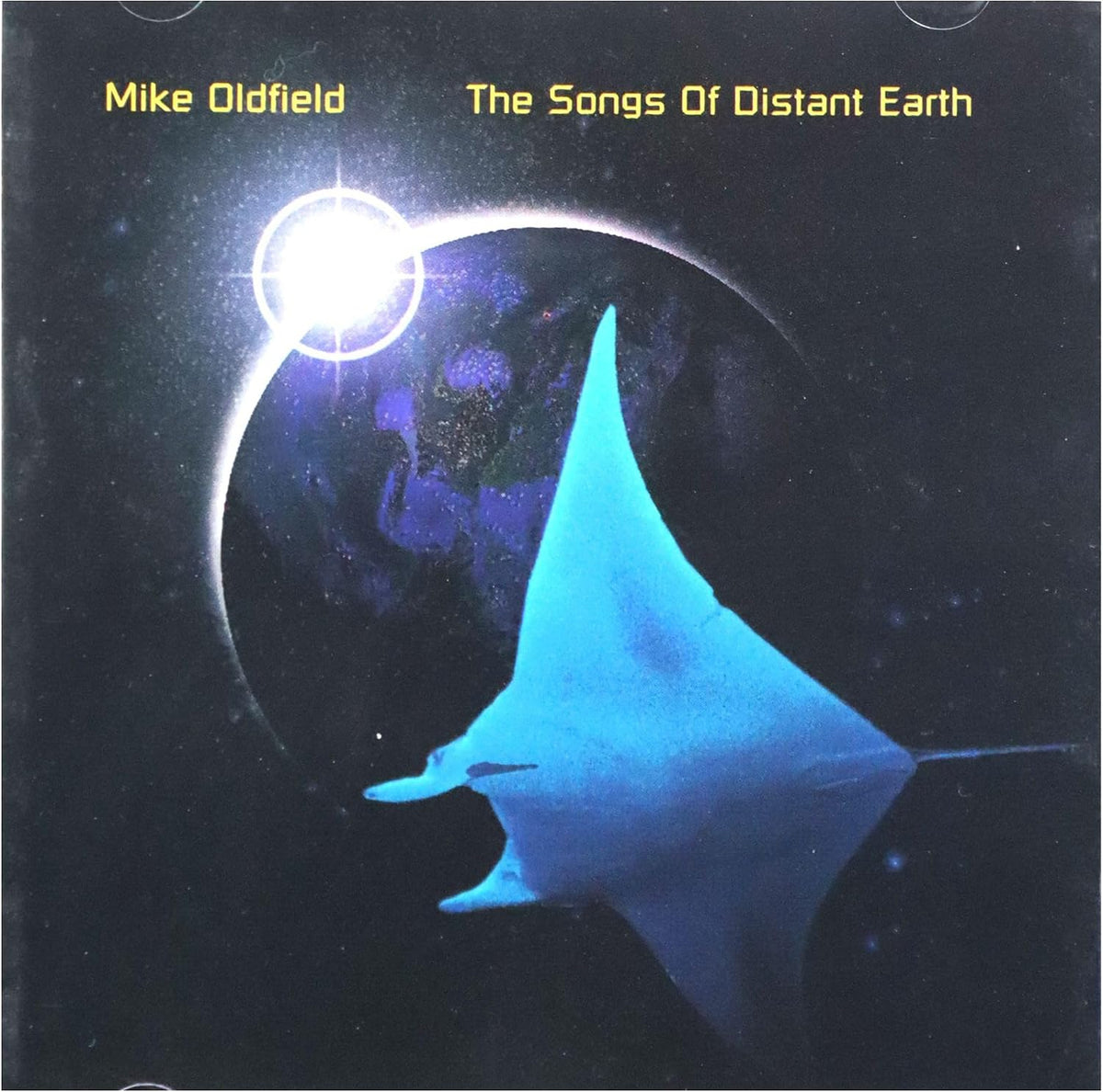 Album cover for Mike Oldfield's 'The Songs Of Distant Earth', featuring a glowing blue manta ray swimming in front of a dark planet and bright sun in space.