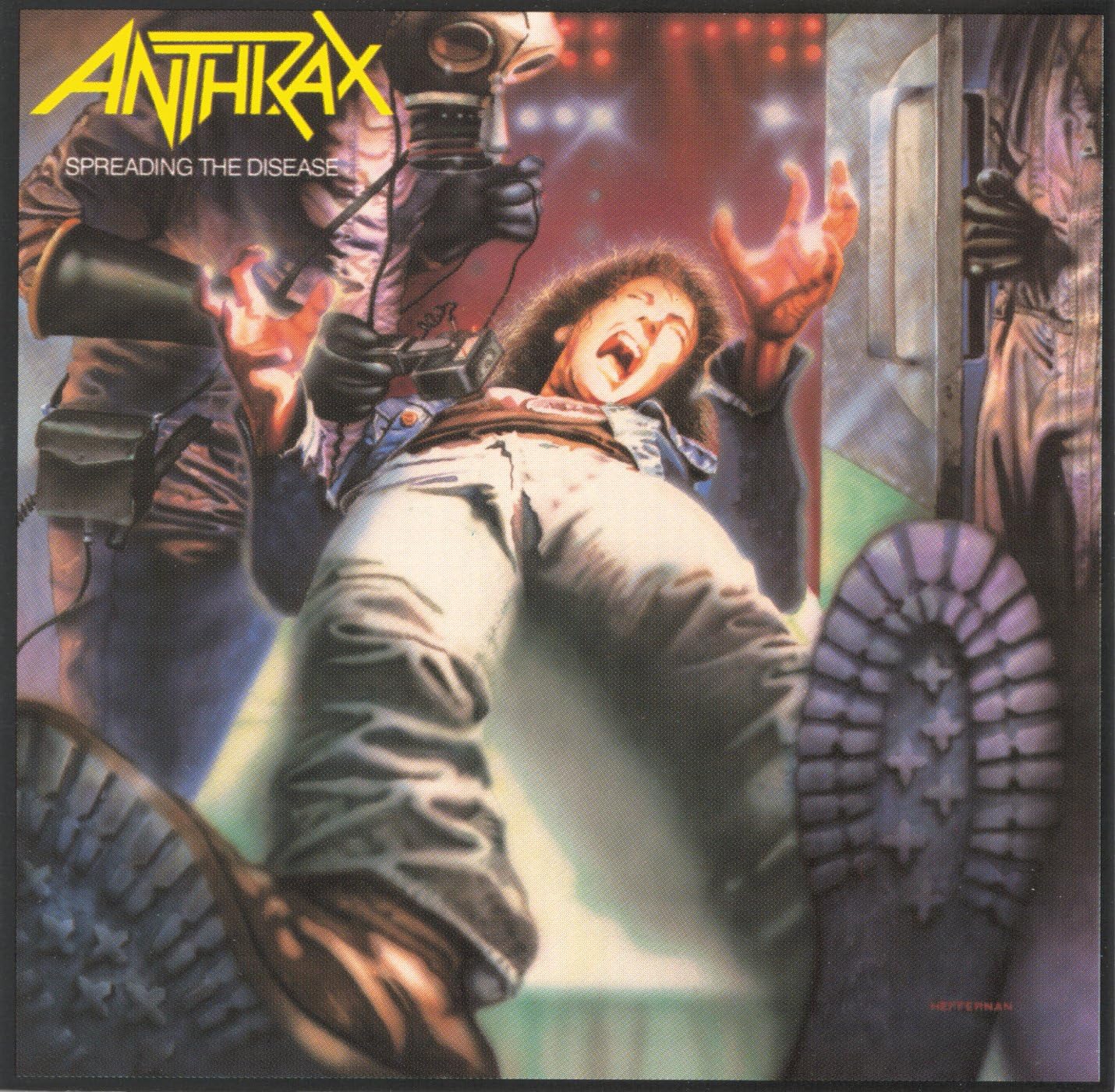 Album cover for Anthrax's 'Spreading the Disease' with a central figure and text.