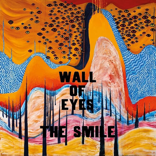 CD cover art featuring abstract orange and blue shapes with the text 'WALL OF EYES THE SMILE' prominently displayed.