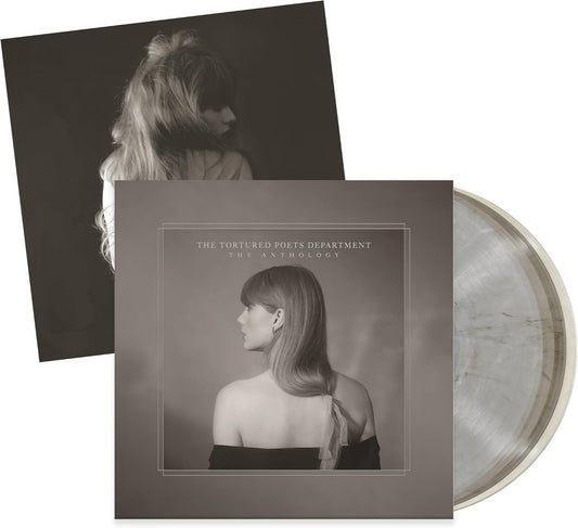 Vinyl record with cover featuring a black and white portrait of a woman, on a white background.