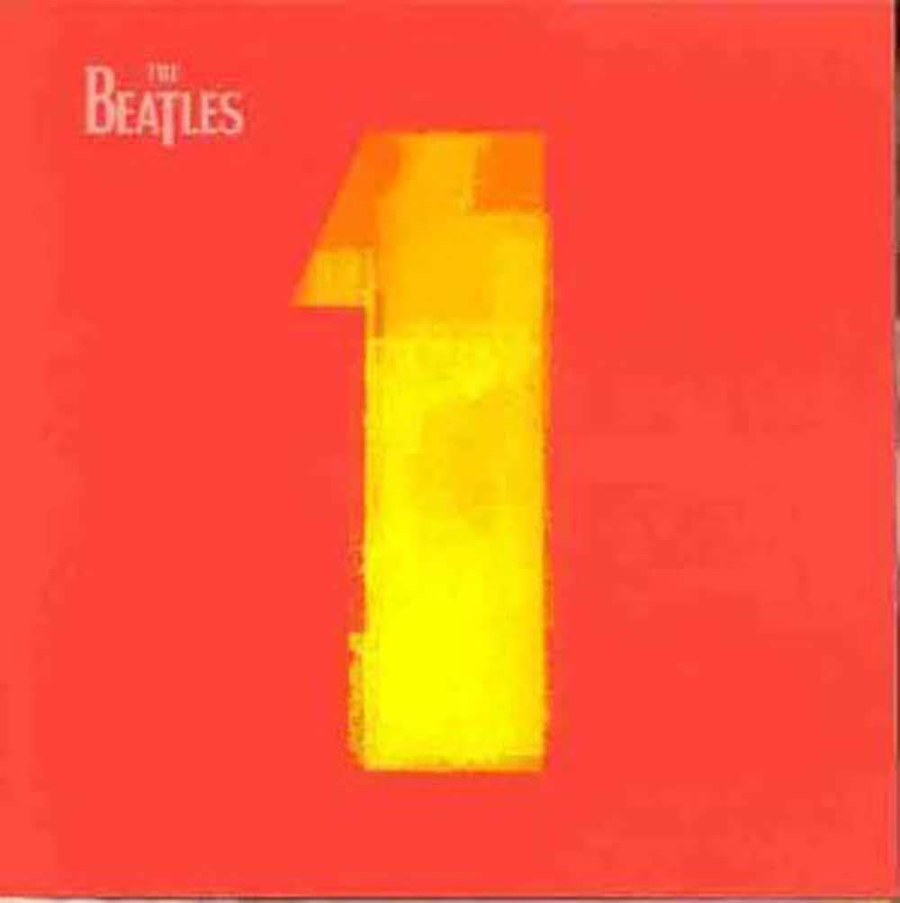 Album cover with 'The Beatles' and a large yellow number '1' on a red background