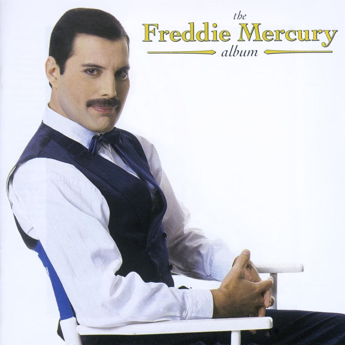 Album cover featuring a person in formal attire with 'Freddie Mercury album' text.
