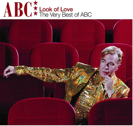 Album cover for 'Look of Love: The Very Best of ABC' featuring a man in a gold sequined jacket sitting in red theater seats, with the title text at the top.