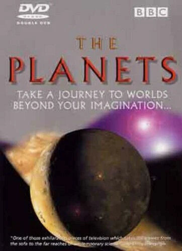 BBC DVD cover for 'The Planets' double-vidео, featuring a large dark planet in the foreground, a smaller yellow planet on the left, and purple planets in the background against a gray sky with the title in red letters.