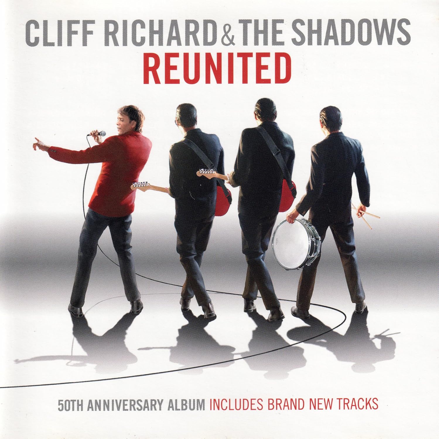 Album cover for 'Cliff Richard & The Shadows Reunited' with four band members holding instruments on a white background.