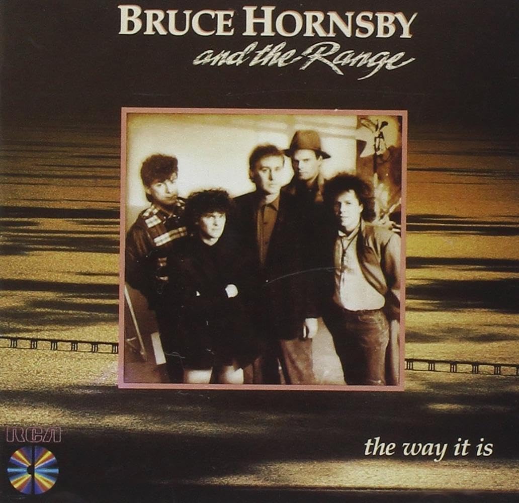 Album cover of 'The Way It Is' by Bruce Hornsby and the Range with a photo of the band on a dark background.