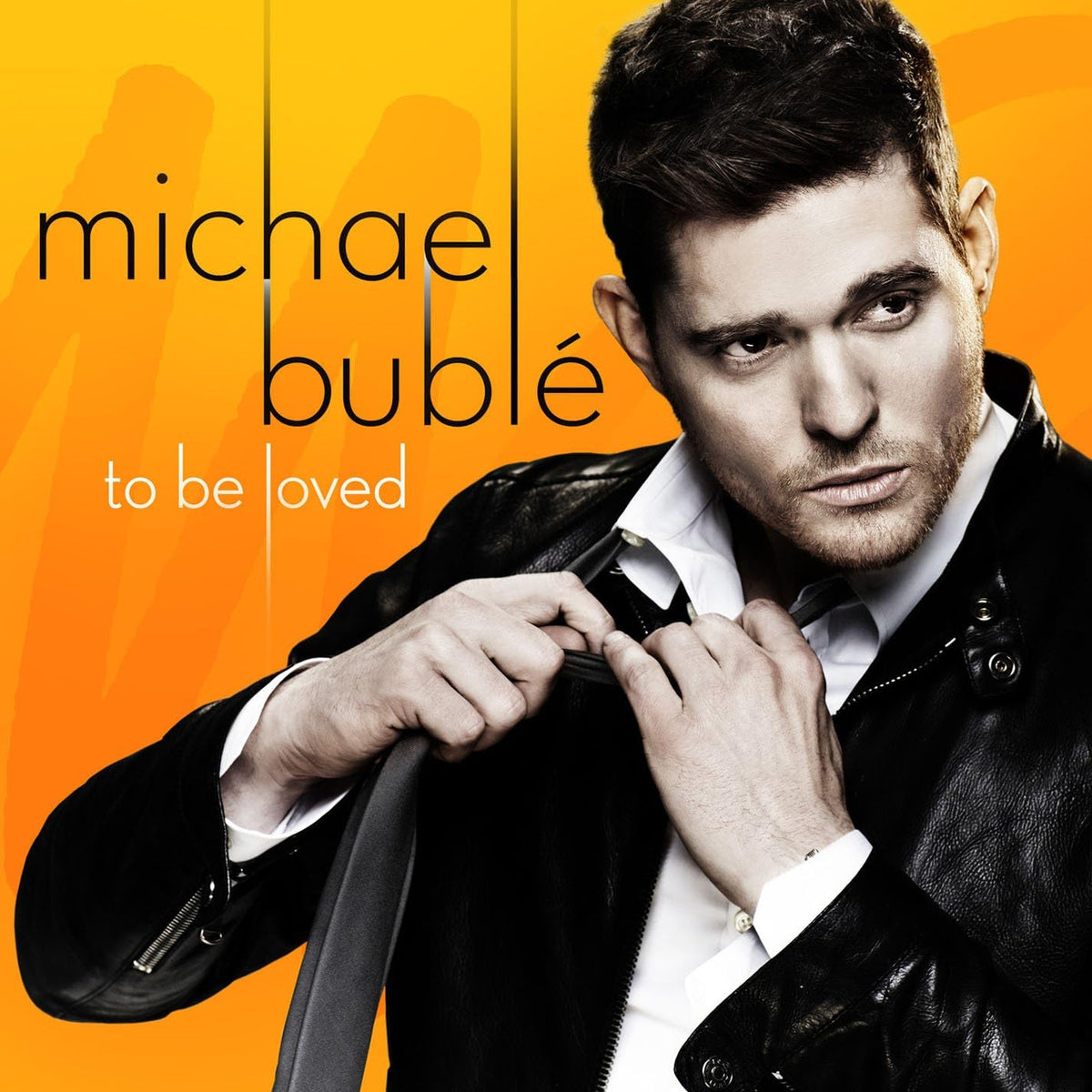 Album cover featuring a man adjusting his jacket with 'Michael Bublé' and 'To Be Loved' text on an orange background.