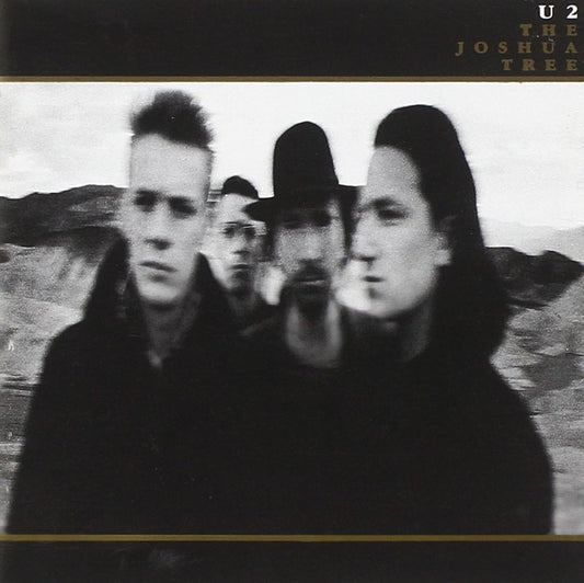 U2 band members in black and white, album cover for 'The Joshua Tree'.