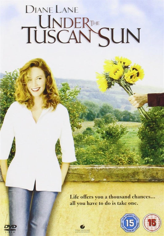 Movie poster for 'Under the Tuscan Sun' featuring a woman with flowers and a scenic background.