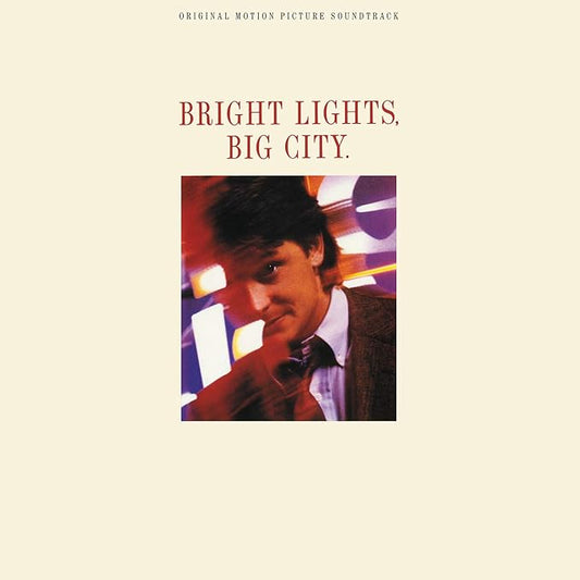 Album cover for 'Bright Lights, Big City' with a portrait of a man on a beige background.