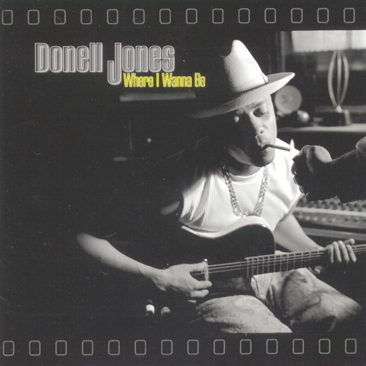Album cover with a person playing guitar and smoking, featuring 'Donell Jones' and 'Where I Wanna Be'.