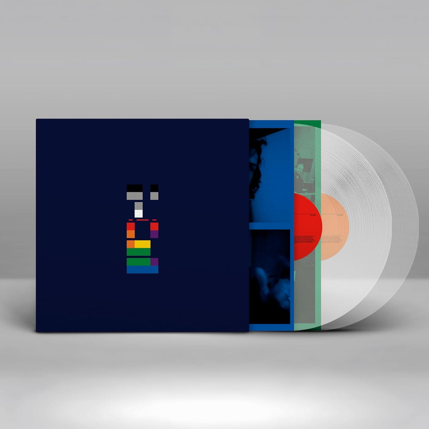 Vinyl record with a colorful cover on a gray background