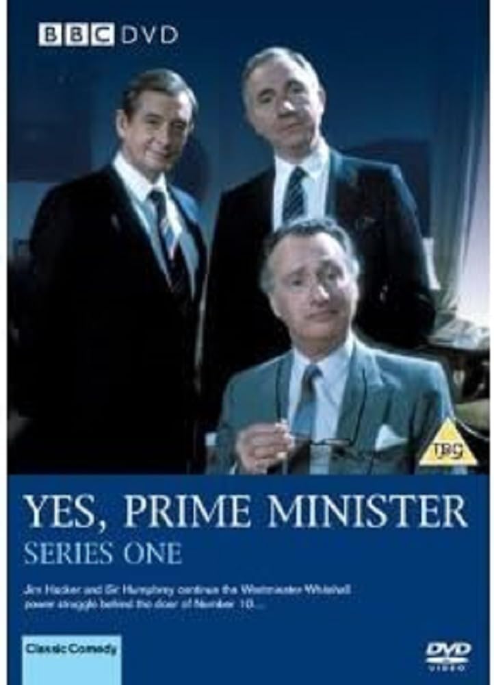 BBC DVD cover for 'Yes, Prime Minister Series One' featuring three men in suits against a dark blue background with white title text and a yellow TRS rating logo.