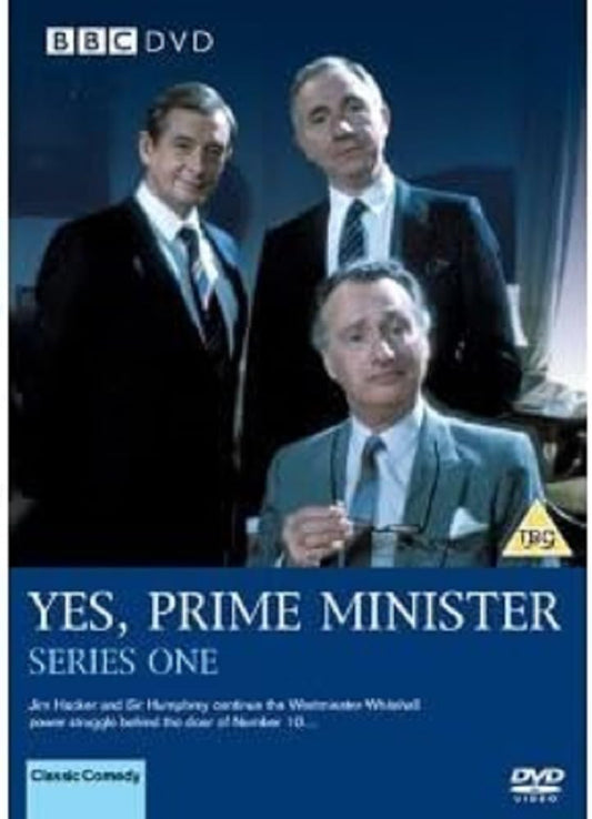 BBC DVD cover for 'Yes, Prime Minister Series One' featuring three men in suits against a dark blue background with white title text and a yellow TRS rating logo.