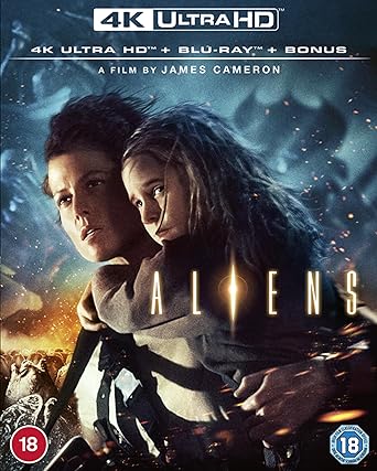 Aliens 4K Ultra HD Blu-ray cover featuring two characters from the film, with a predominantly black background and text detailing the film's title and format.
