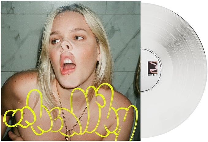 Vinyl record with a person's face and yellow text overlay