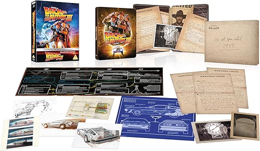 Back to the Future III collector's edition packaging with various items including a poster, blueprint, and documents.