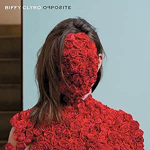 Album cover with a person covered in red roses against a blue background