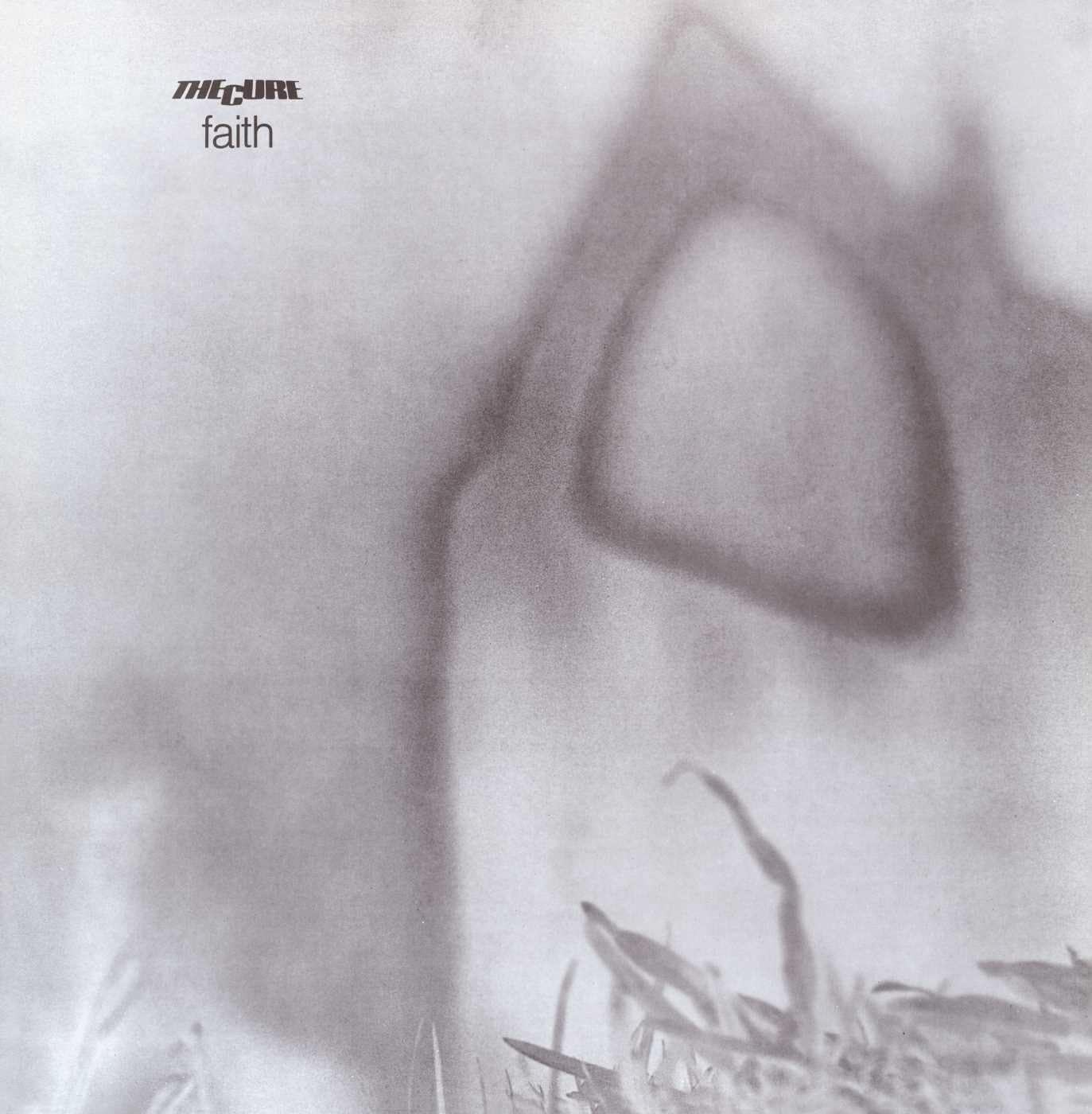 The image displays the album cover of 'The Cure Faith LP Vinyl'. It features a muted, monochrome photograph of a figure standing by a body of water, with a blurred, shadowy outline prominently in the foreground.